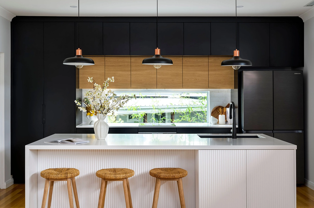 kitchen with black hanging lights