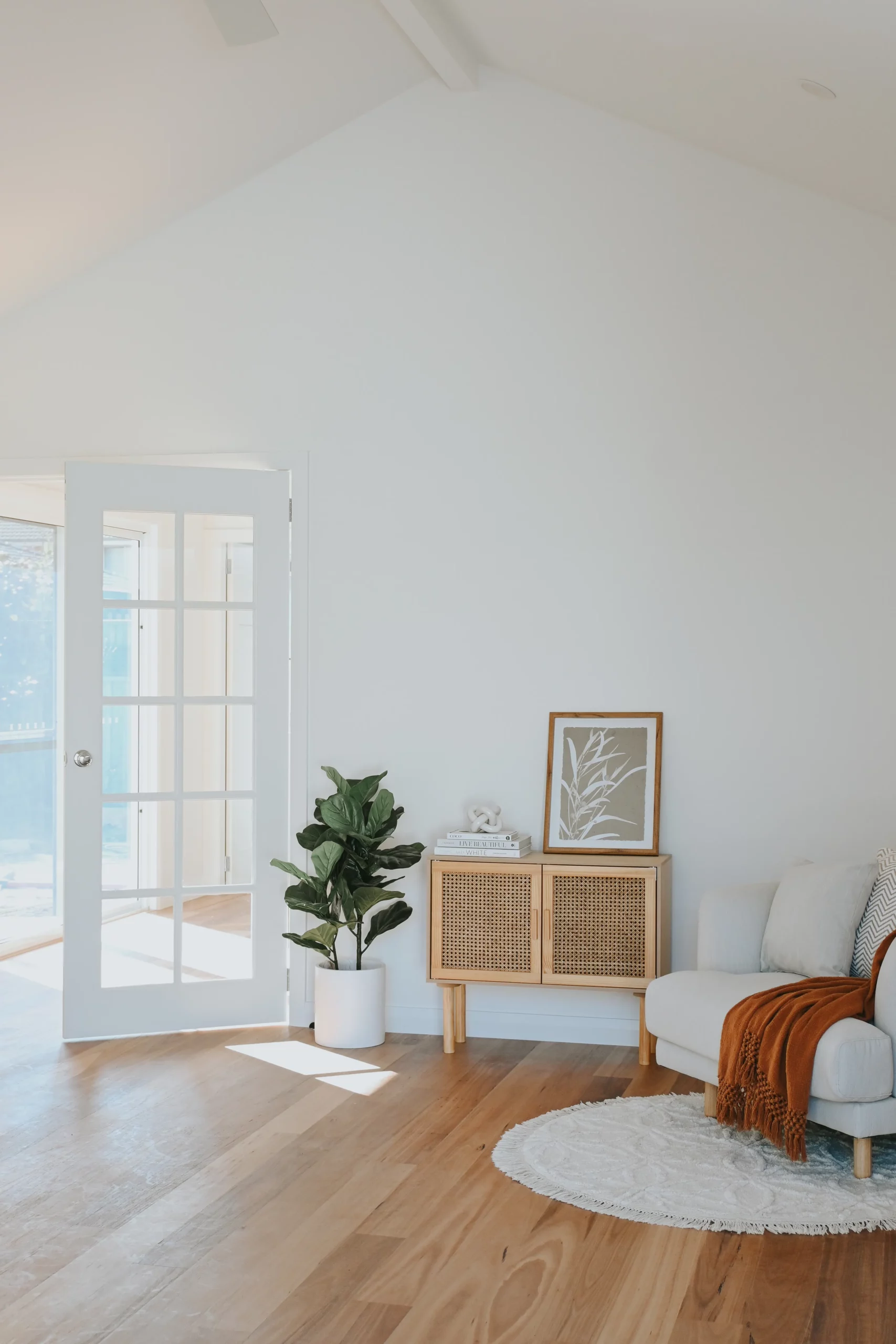 living room with high ceilings and lounge chair